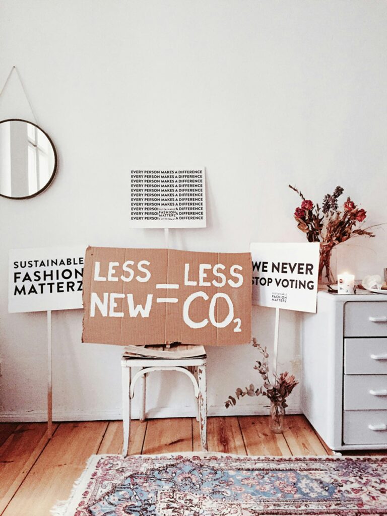 sustainable fashion protest sign in a room